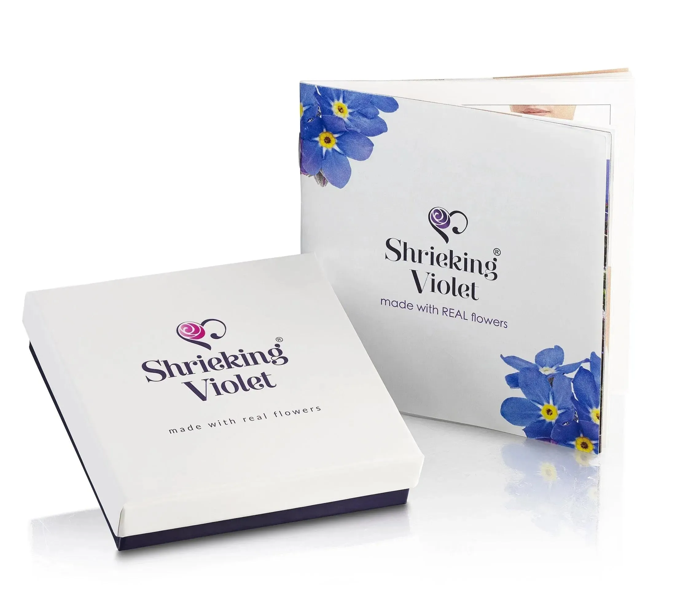 Flower ring by Shrieking Violet Sterling silver adjustable ring. Heart charm filled with tiny flowers including a  miniature rose & forget-me not