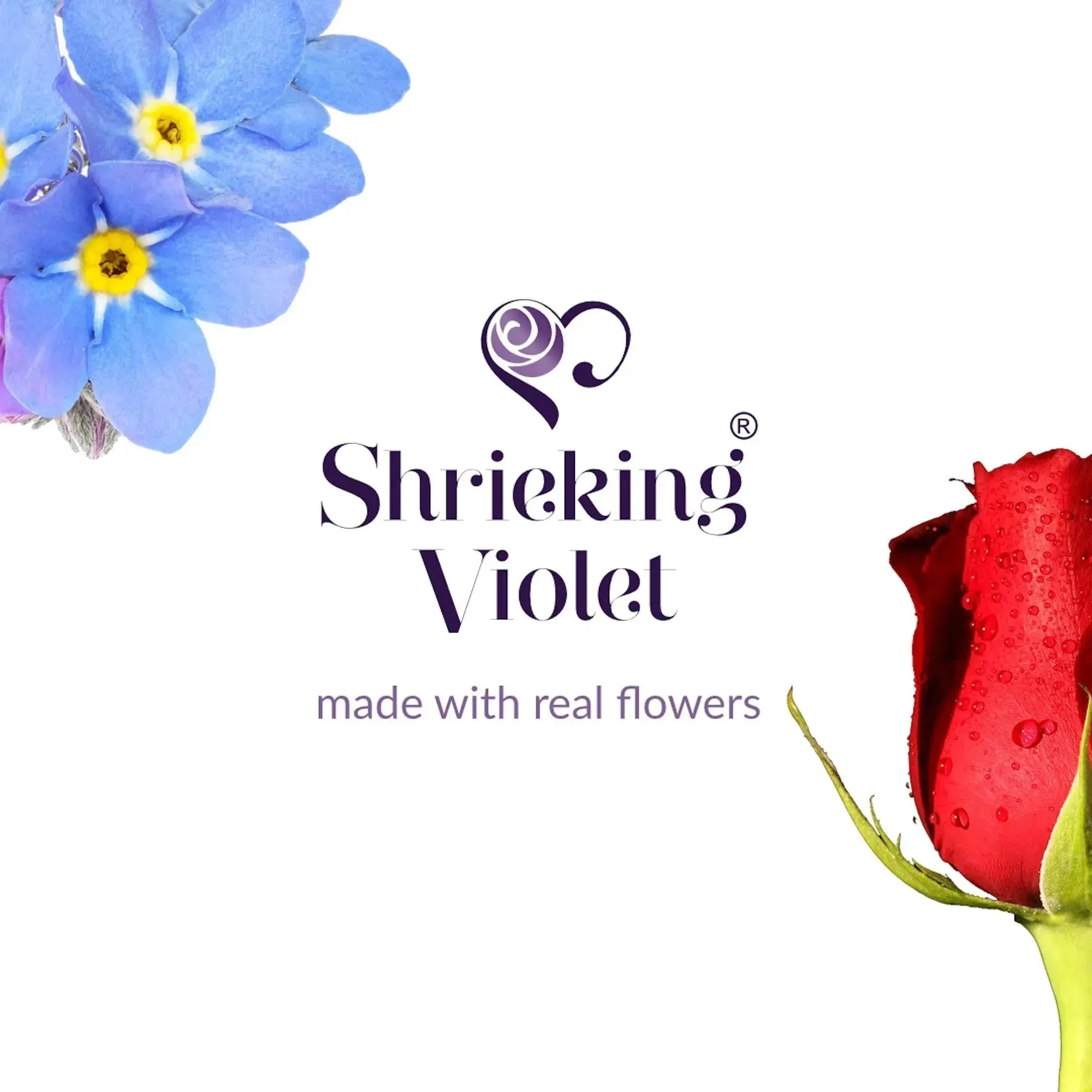 Flower ring by Shrieking Violet Sterling silver adjustable ring. Heart charm filled with tiny flowers including a  miniature rose & forget-me not